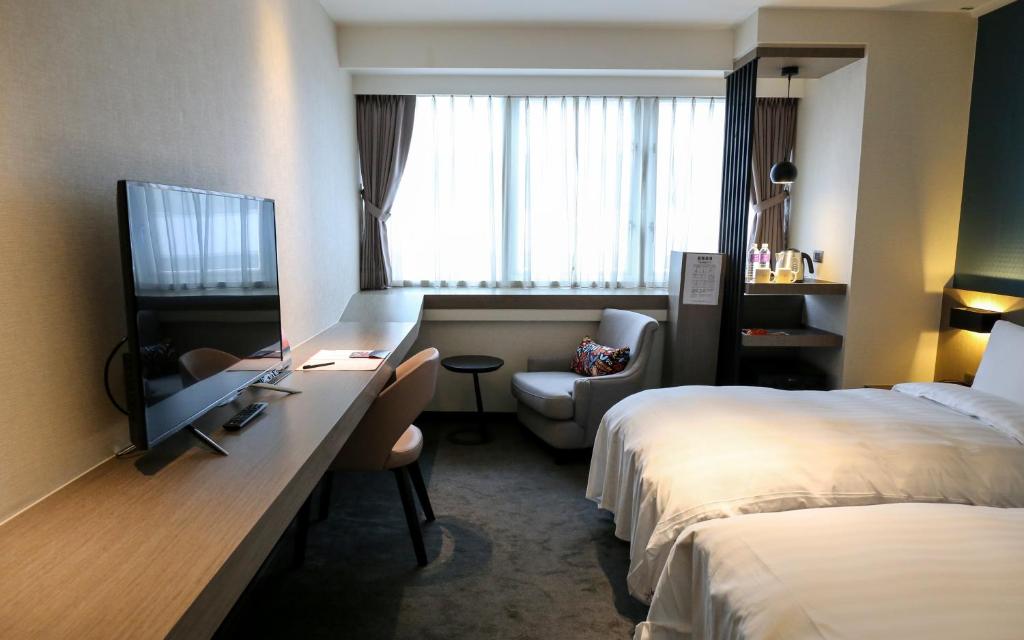 Postel nebo postele na pokoji v ubytování Wonstar Hotel