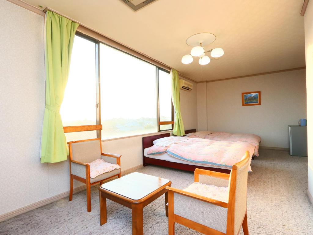 Postel nebo postele na pokoji v ubytování Seaside Hotel Kujukuri