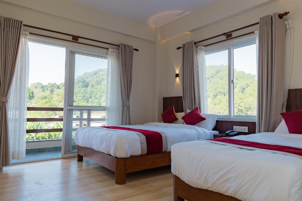 Cama o camas de una habitación en Hotel Sandalwood