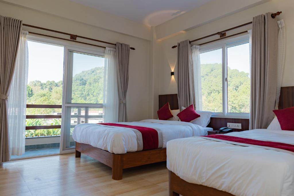 Postel nebo postele na pokoji v ubytování Hotel Sandalwood