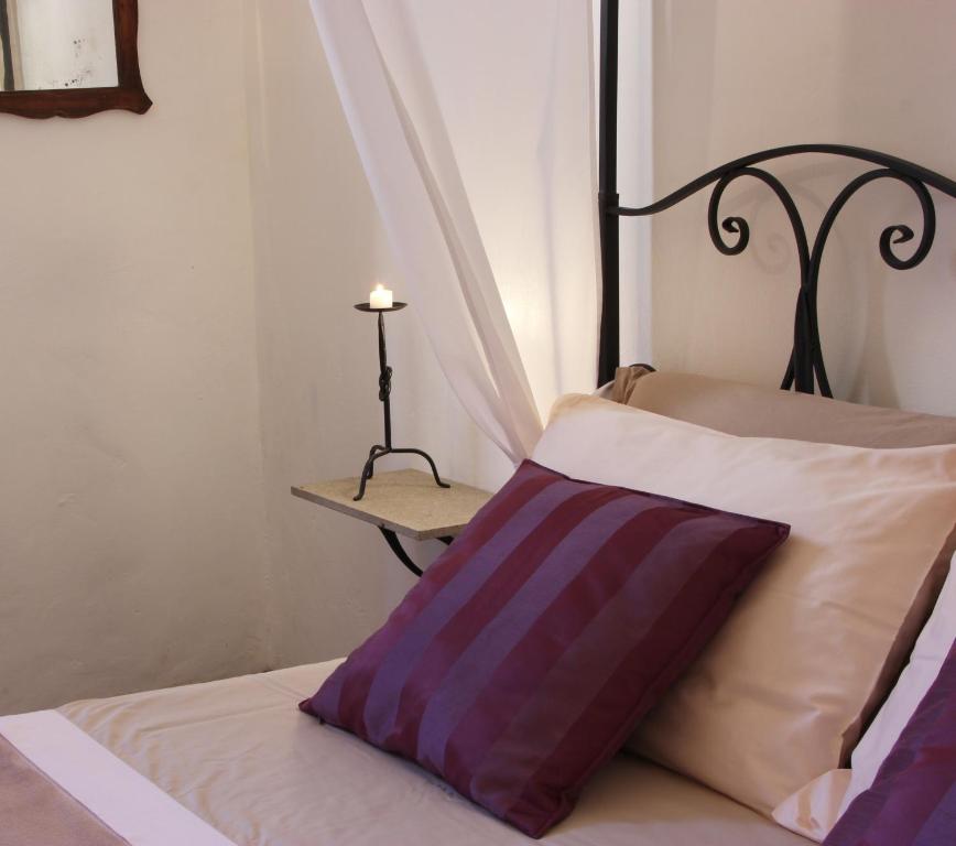 Postel nebo postele na pokoji v ubytování InChiostro Rooms&Breakfast