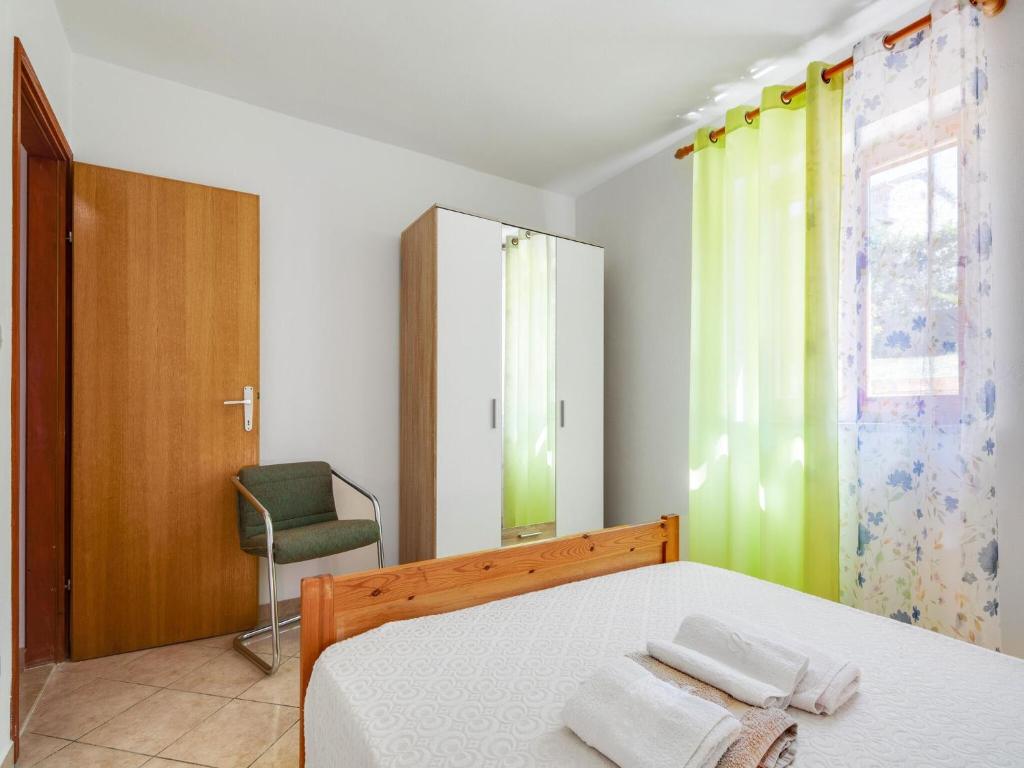 Postel nebo postele na pokoji v ubytování Cozy Apartment Stay in Porec