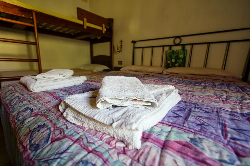 Letto o letti in una camera di Biobagnolese Agriturismo