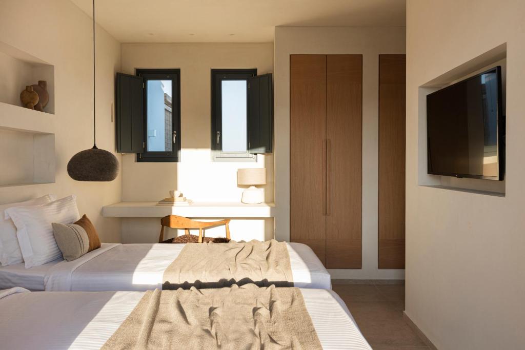 Postel nebo postele na pokoji v ubytování Phos Milos