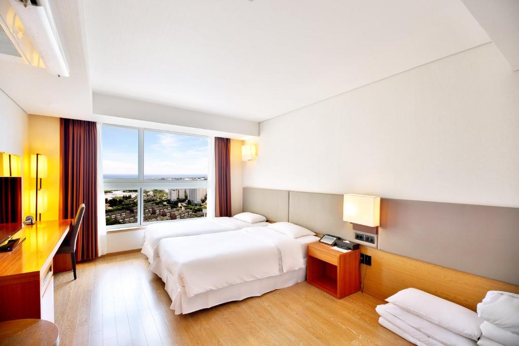 Postel nebo postele na pokoji v ubytování Bareve Hotel