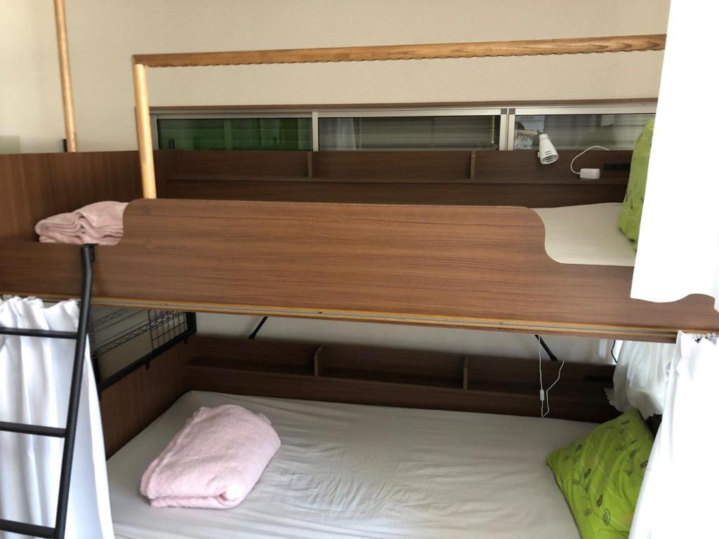 a pair of bunk beds in a room at Kōnotori no sato no yado - Vacation STAY 11102 in Kōnosu