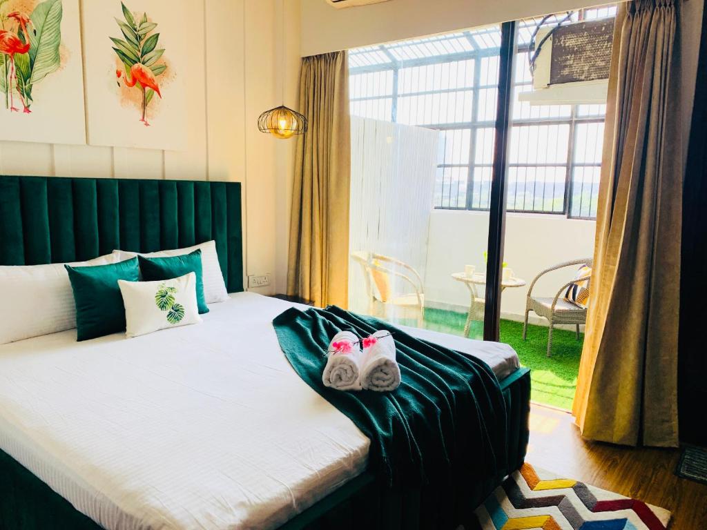 Postel nebo postele na pokoji v ubytování Olive Service Apartments - City Centre Noida