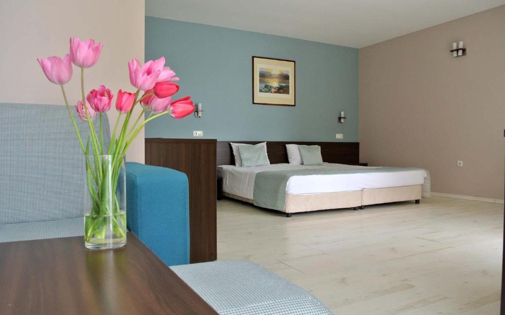 Postel nebo postele na pokoji v ubytování Valeo Hotel