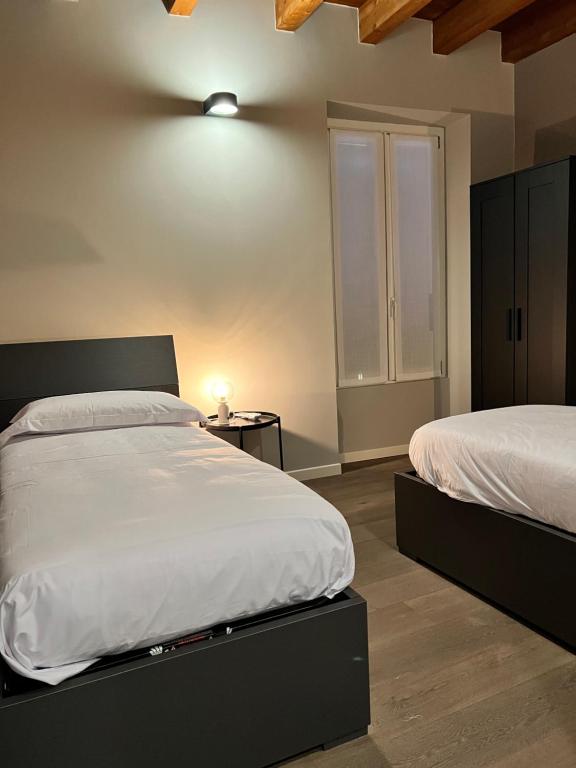 Postel nebo postele na pokoji v ubytování V&B Suites and Apartments