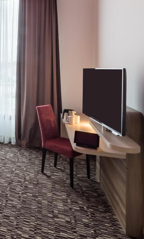 TV a/nebo společenská místnost v ubytování Park Inn by Radisson Neumarkt