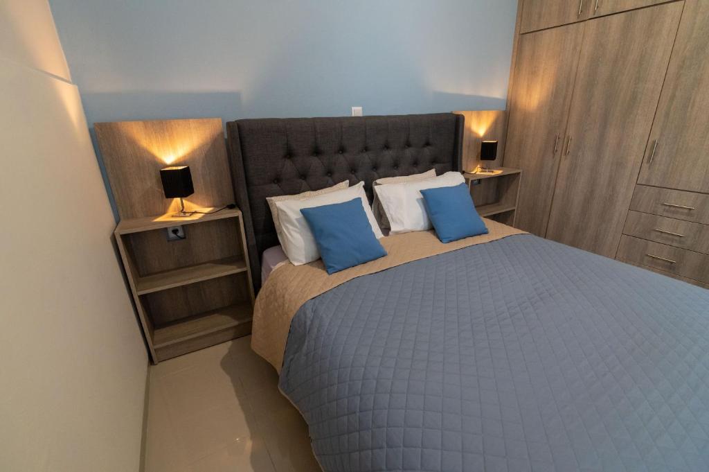 Säng eller sängar i ett rum på Bleu Maison De Vivian