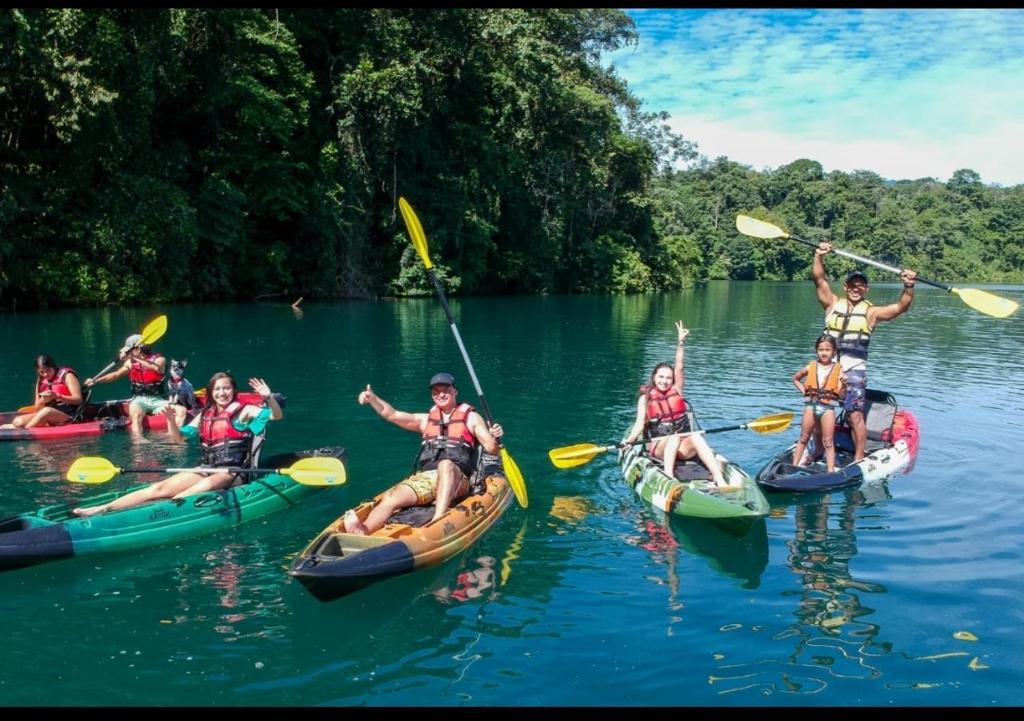a group of people on kayaks on a river at Pozas y Cascadas La Presa in Río Cuarto