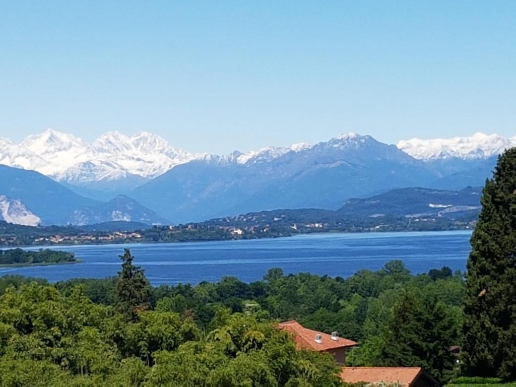 a view of a lake and snow capped mountains at Marianna casa vacanza in Azzate