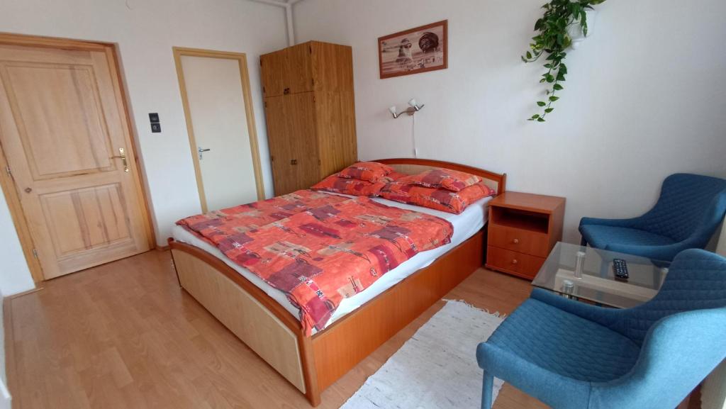 Postel nebo postele na pokoji v ubytování Judit Vendégház