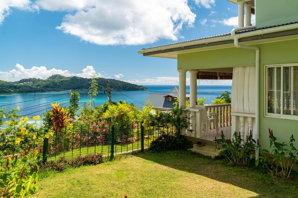 a house with a view of the water at TOP VIEW RETREAT SELFCATERING in Anse a La Mouche