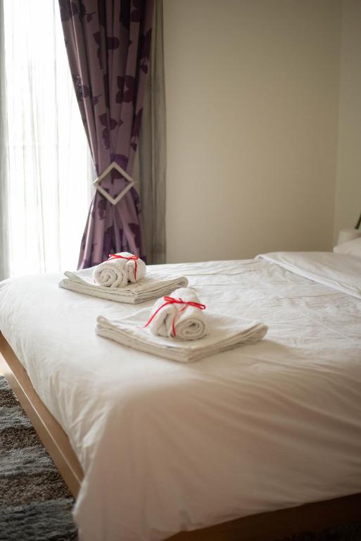 Postel nebo postele na pokoji v ubytování DimSim Home-Σπίτι με όνομα