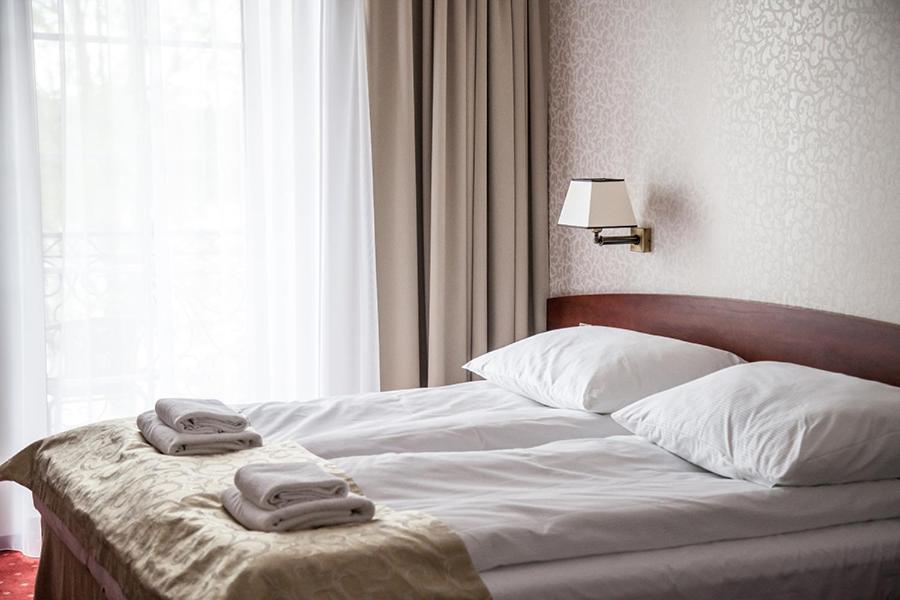 Posteľ alebo postele v izbe v ubytovaní Hotel Stara Gorzelnia