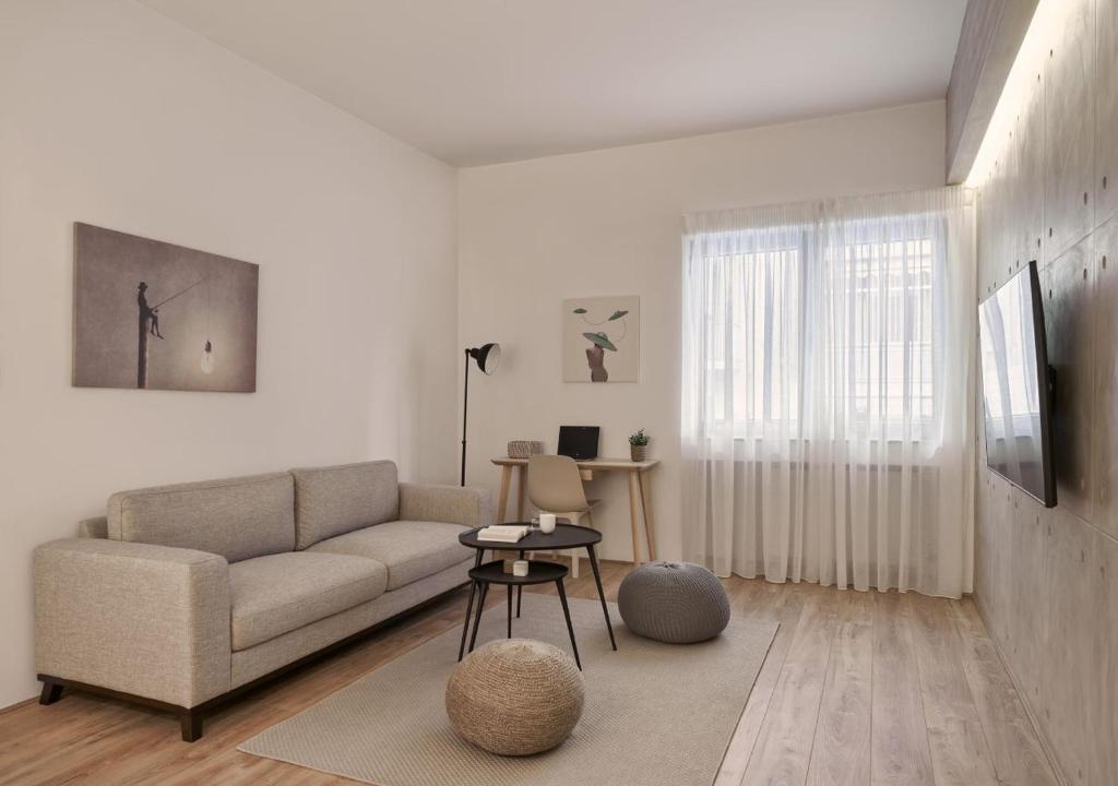 a living room with a couch and a table at Cute n Comfort Luxury Condo in Kolonaki in Athens