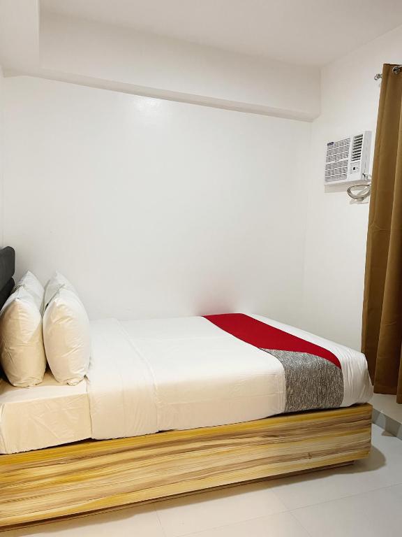 Postel nebo postele na pokoji v ubytování Airo Suites Makati
