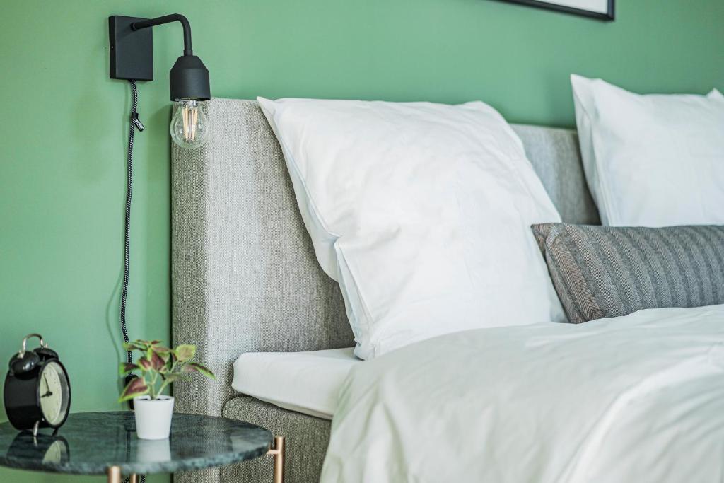 Łóżko lub łóżka w pokoju w obiekcie Arbio I Liv's Place Lux Apartments