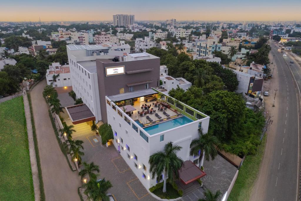 an overhead view of a building with a swimming pool at Sterling V Grand Madurai in Madurai