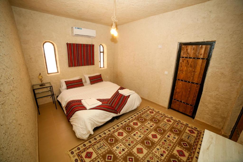Postel nebo postele na pokoji v ubytování Sinam Desert Resort