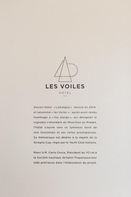 a sign with the las vlases hotel logo at Hôtel Les Voiles in Toulon