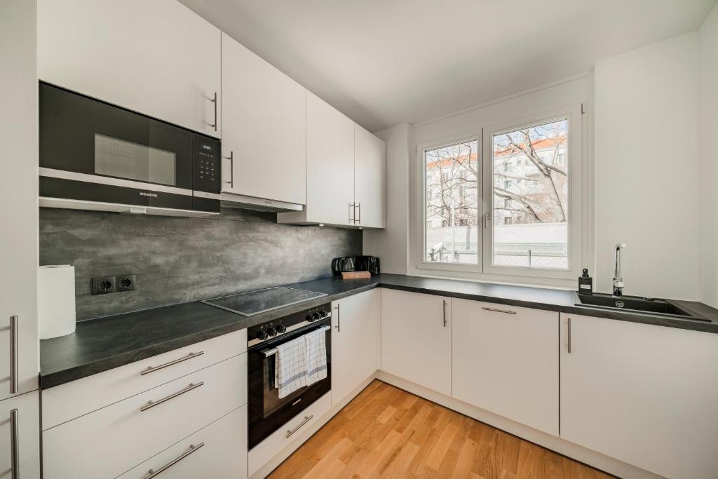 Kuchnia lub aneks kuchenny w obiekcie Arbio I Liv's Place Lux Apartments