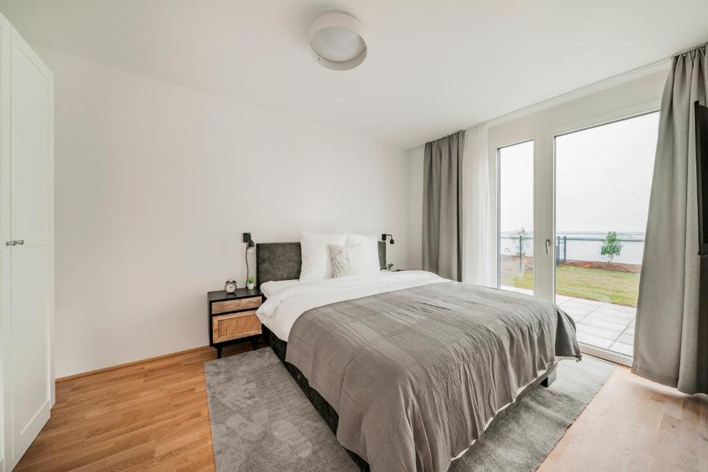 Łóżko lub łóżka w pokoju w obiekcie Arbio I Liv's Place Lux Apartments