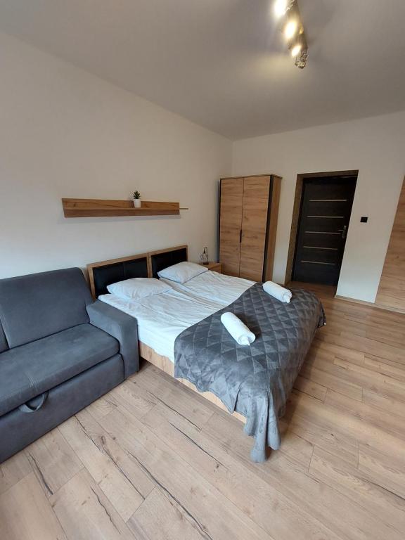 Postel nebo postele na pokoji v ubytování Loft Wisla Houses