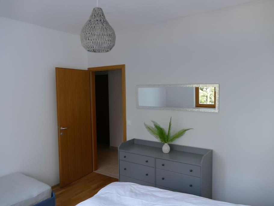 Postel nebo postele na pokoji v ubytování Forest Green Pohorje Apartment