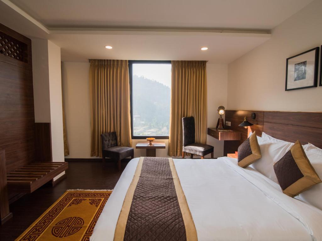 Letto o letti in una camera di Tree of Life Indra Mandala Hotel, Gangtok