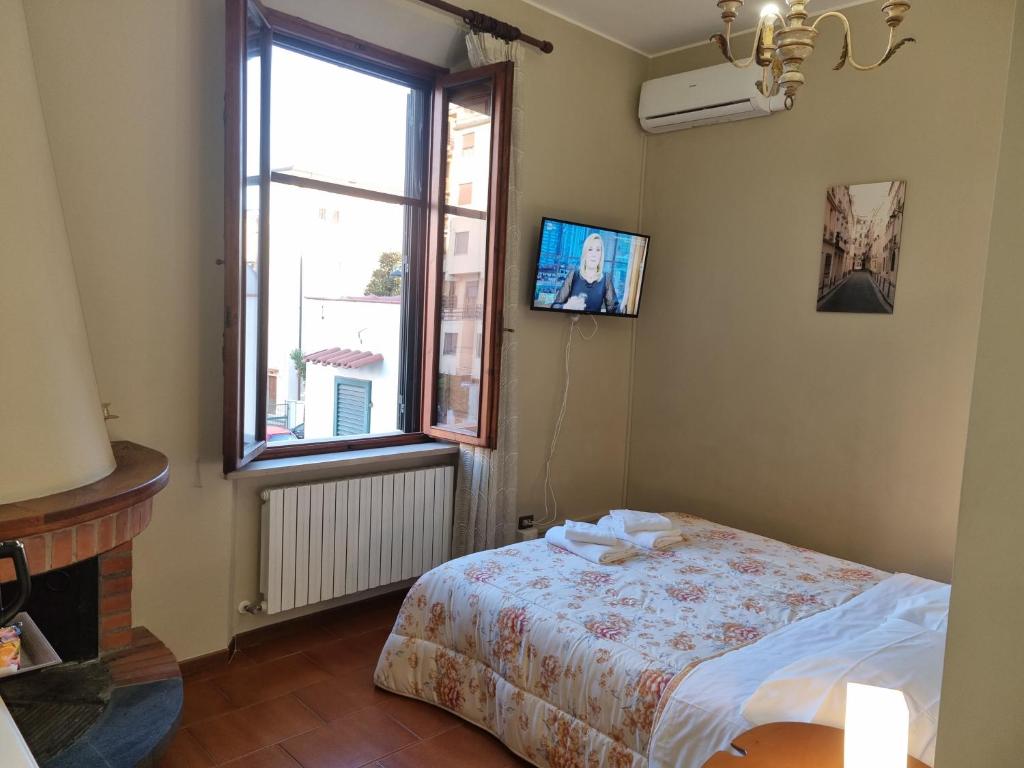 Posteľ alebo postele v izbe v ubytovaní Villa Rismondo Pisa