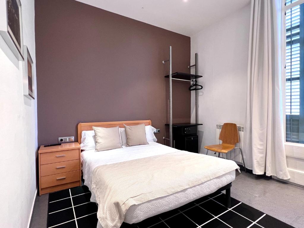 Postel nebo postele na pokoji v ubytování Hostal Apolo