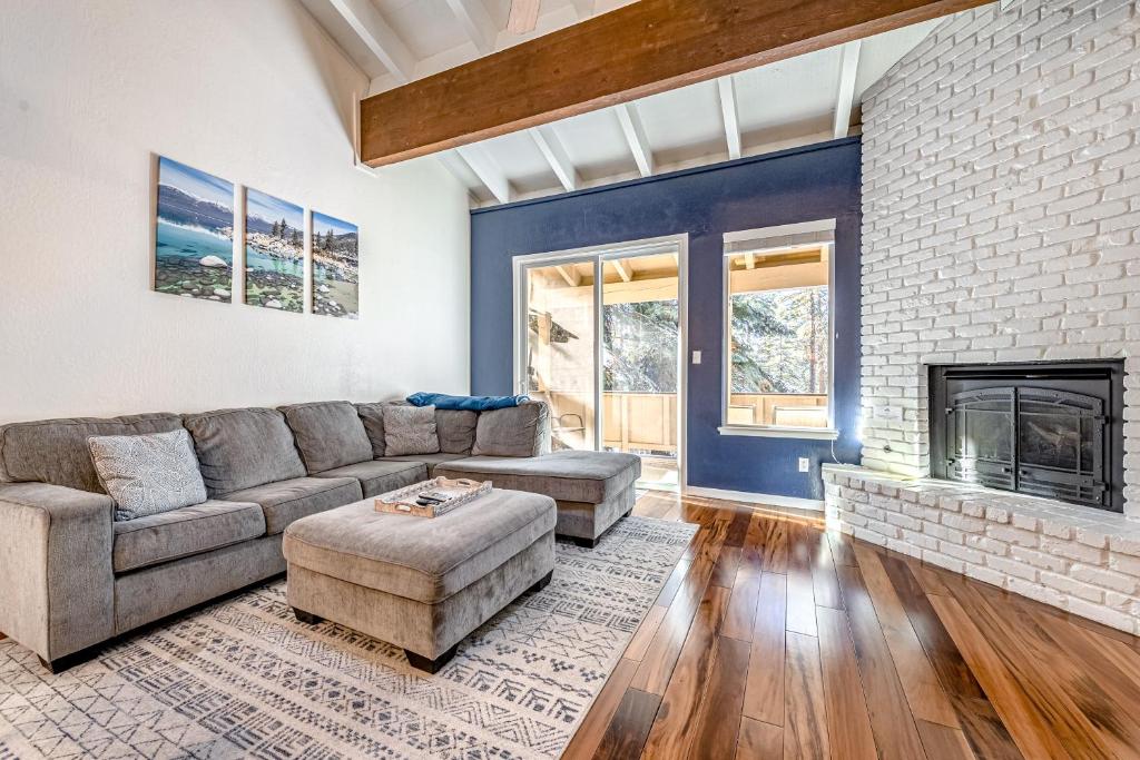a living room with a couch and a fireplace at Take Me to Tahoe in Incline Village