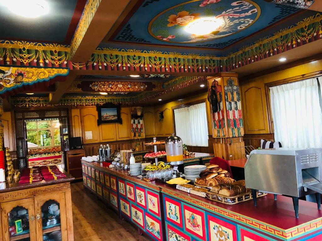 a kitchen with a counter with food on it at Kathmandu View Hotel in Kathmandu