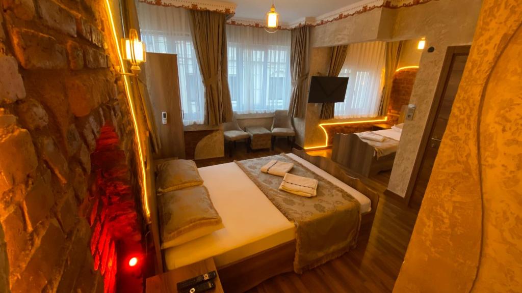 Postel nebo postele na pokoji v ubytování GOLDEN ARROW OLD CİTY HOTEL