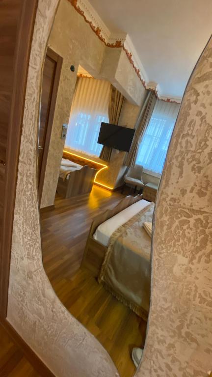 Postel nebo postele na pokoji v ubytování GOLDEN ARROW OLD CİTY HOTEL