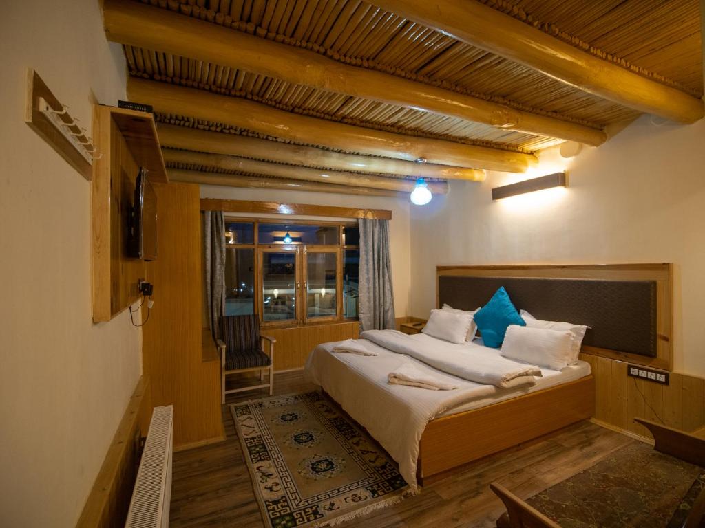 Rúm í herbergi á Siala Guest House