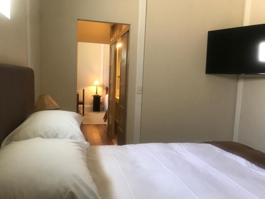 Postel nebo postele na pokoji v ubytování Plaza Central