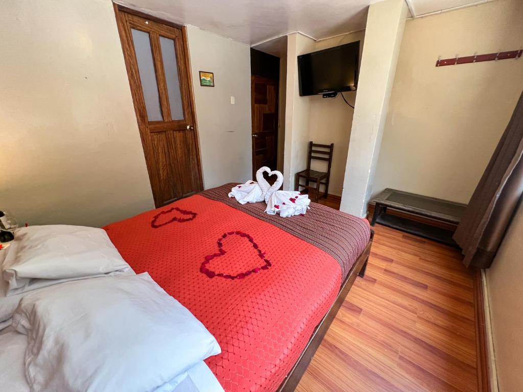 Rúm í herbergi á Nativus Hostel Machu Picchu