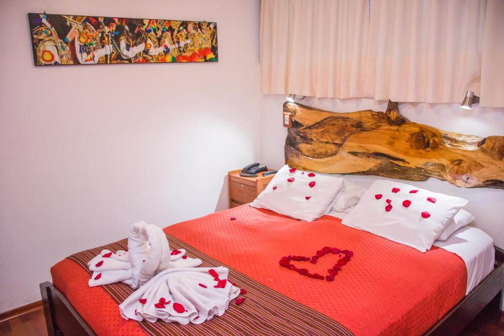 Rúm í herbergi á Nativus Hostel Machu Picchu