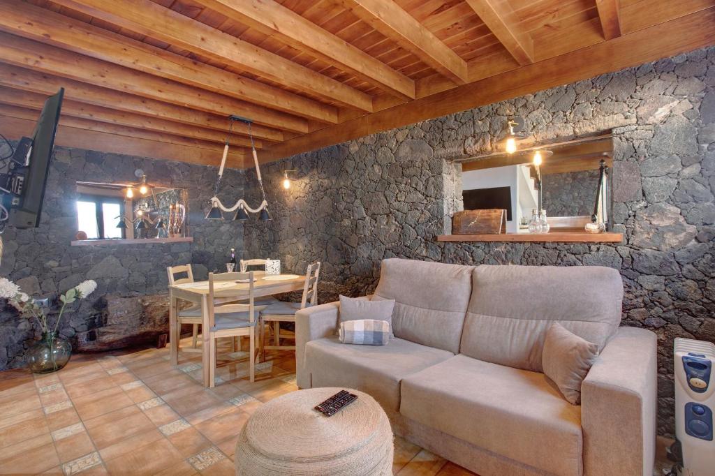 a living room with a couch and a table at Casa Tía Eulalia in Frontera