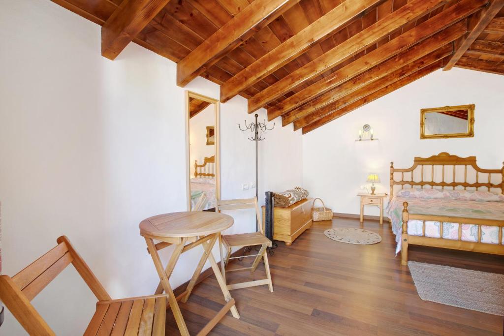 Postel nebo postele na pokoji v ubytování Casa Tía Eulalia