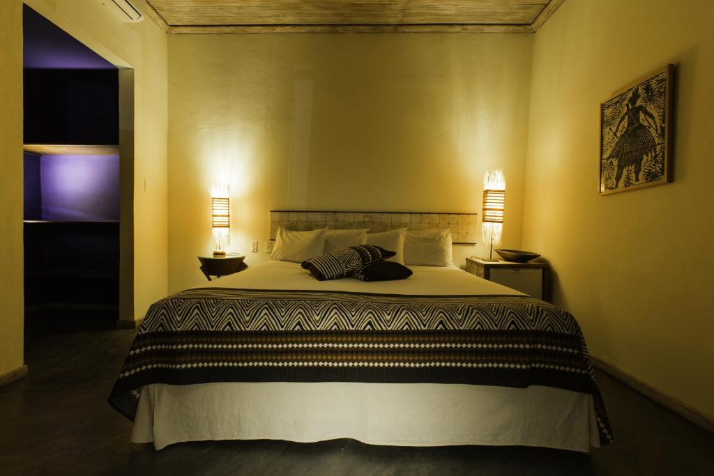 Postel nebo postele na pokoji v ubytování Bahiacafé Hotel