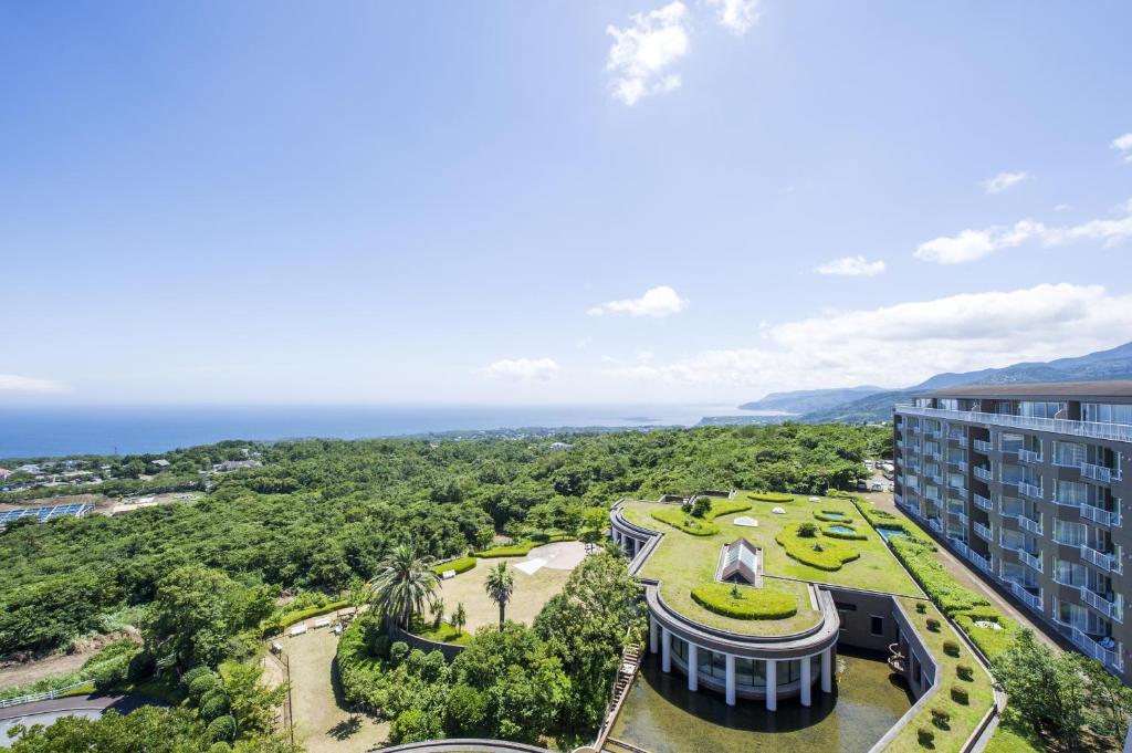 an aerial view of a resort with the ocean in the background at Hotel Village Izukogen in Ito