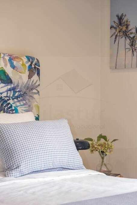 A bed or beds in a room at Silmo Ático By Silastur