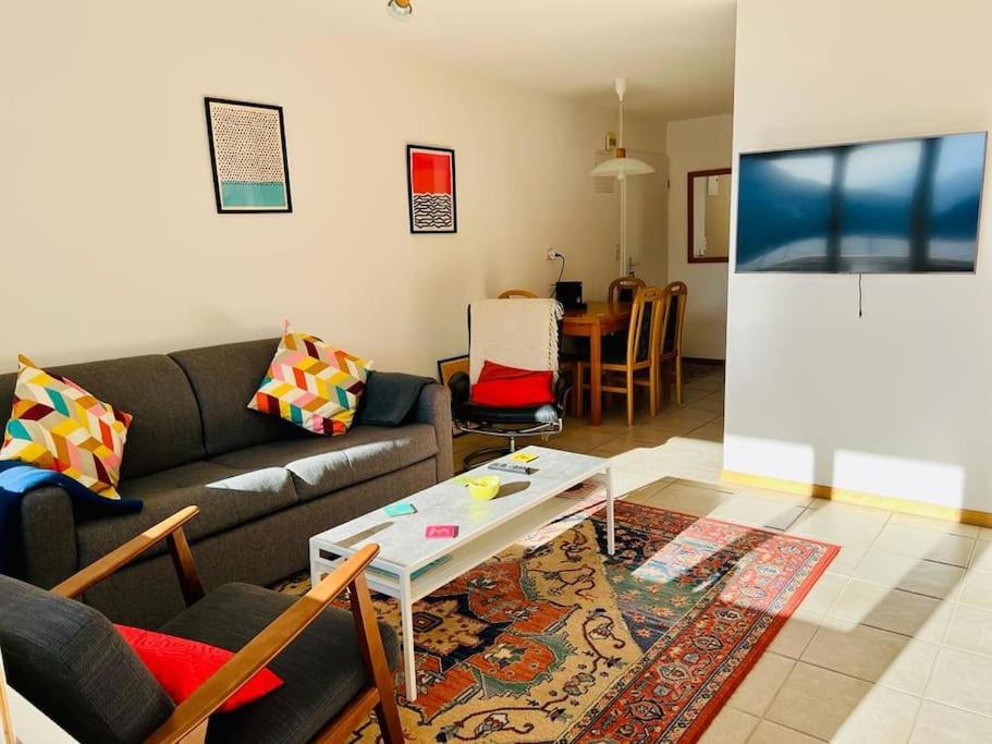 a living room with a couch and a table at Flüe 8 in Leukerbad