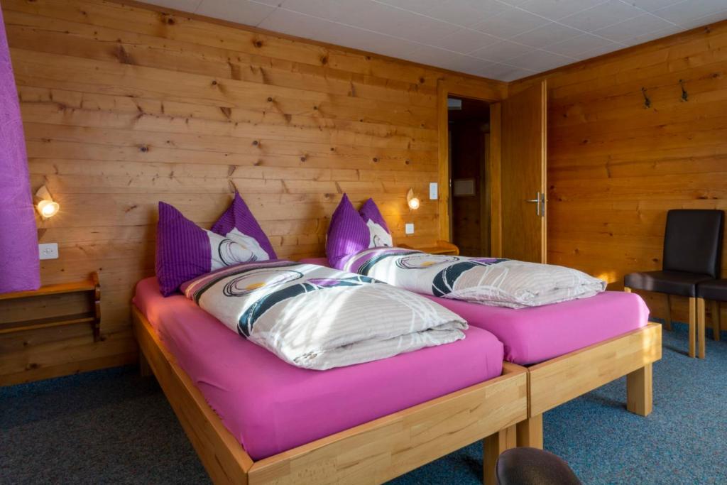 Postel nebo postele na pokoji v ubytování Chalet Weisshorn 2