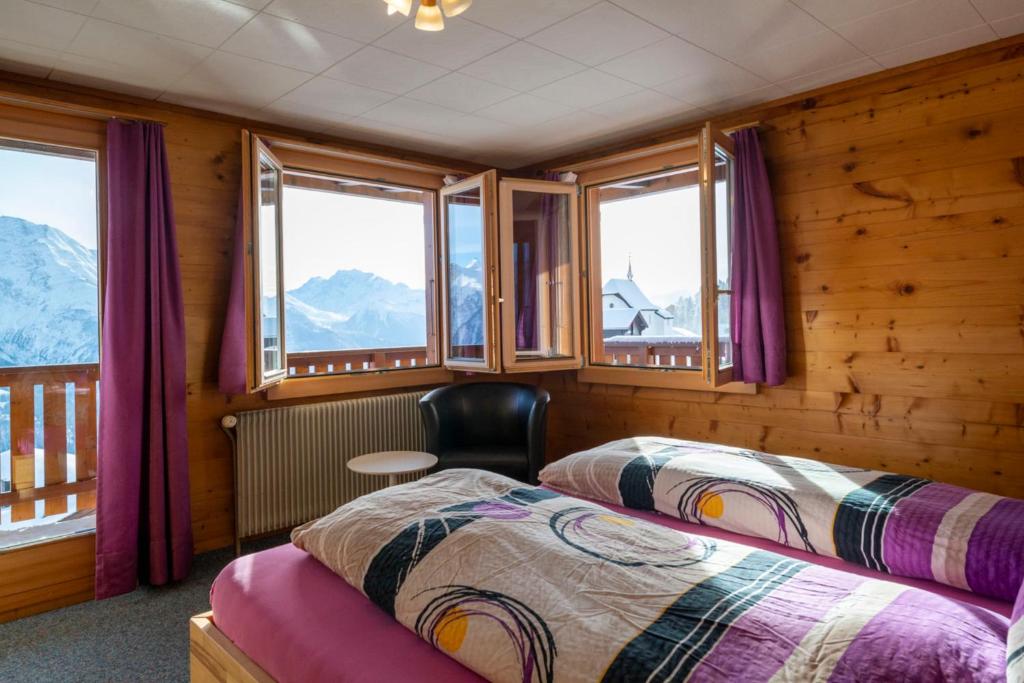 Postel nebo postele na pokoji v ubytování Chalet Weisshorn 2